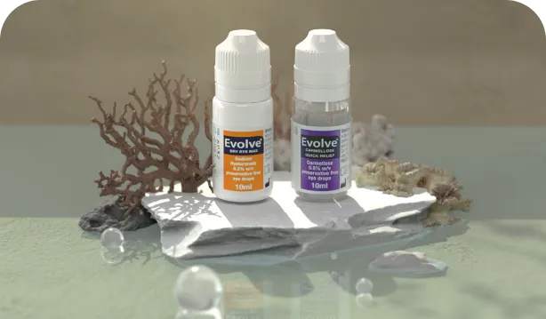 Evolve bottles arranged with coral on a beach surface