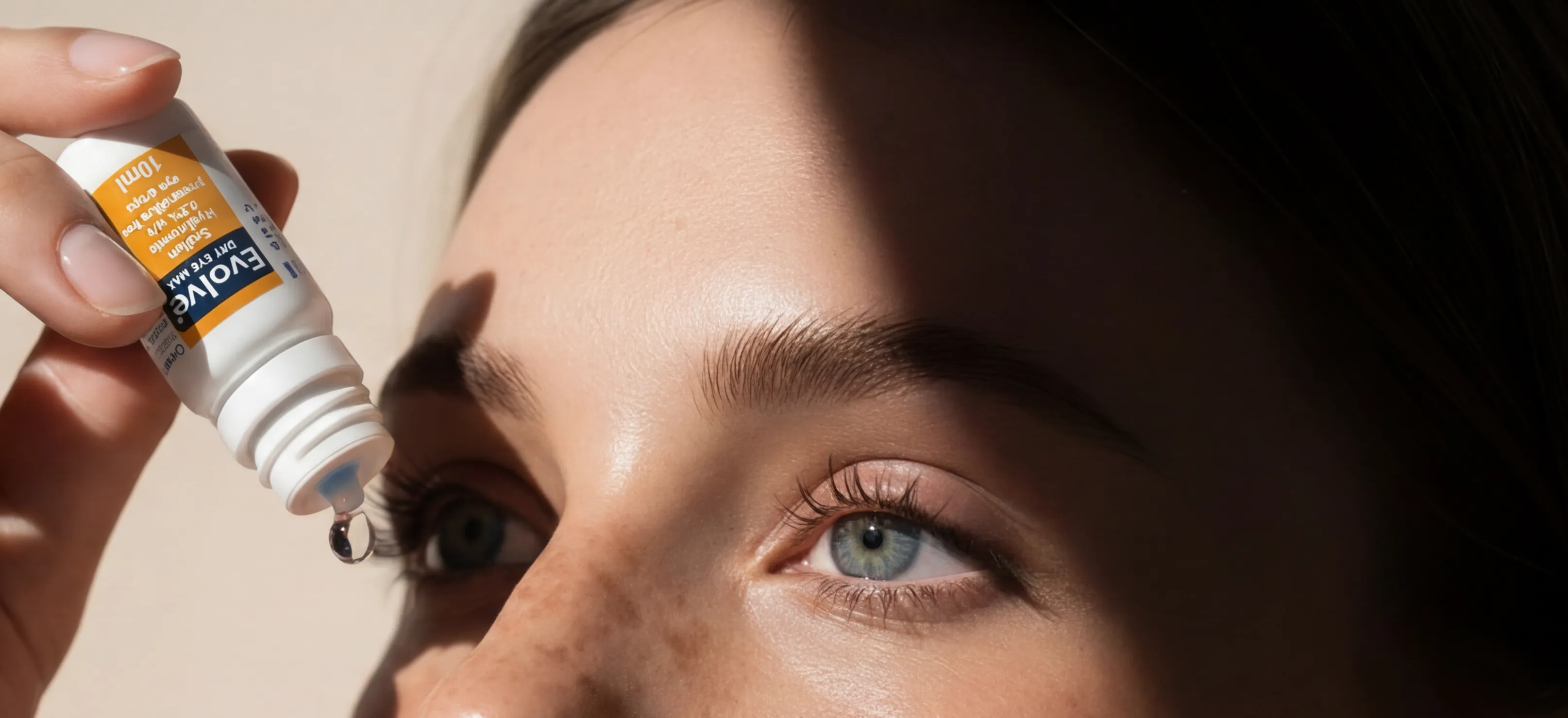 Close-up of a woman applying Evolve eye drops