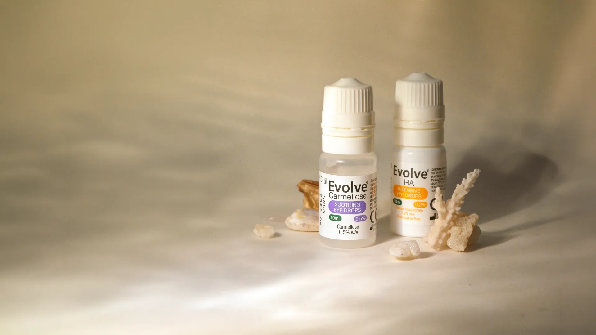 Evolve eye drops on a natural mossy backdrop