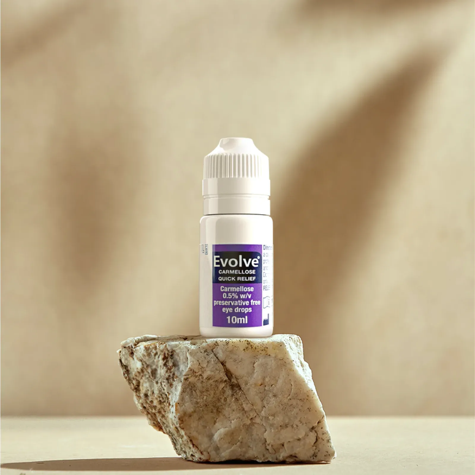Evolve Quick Relief bottle on a stone podium